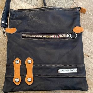 Chicks and girlies leather messenger bag.